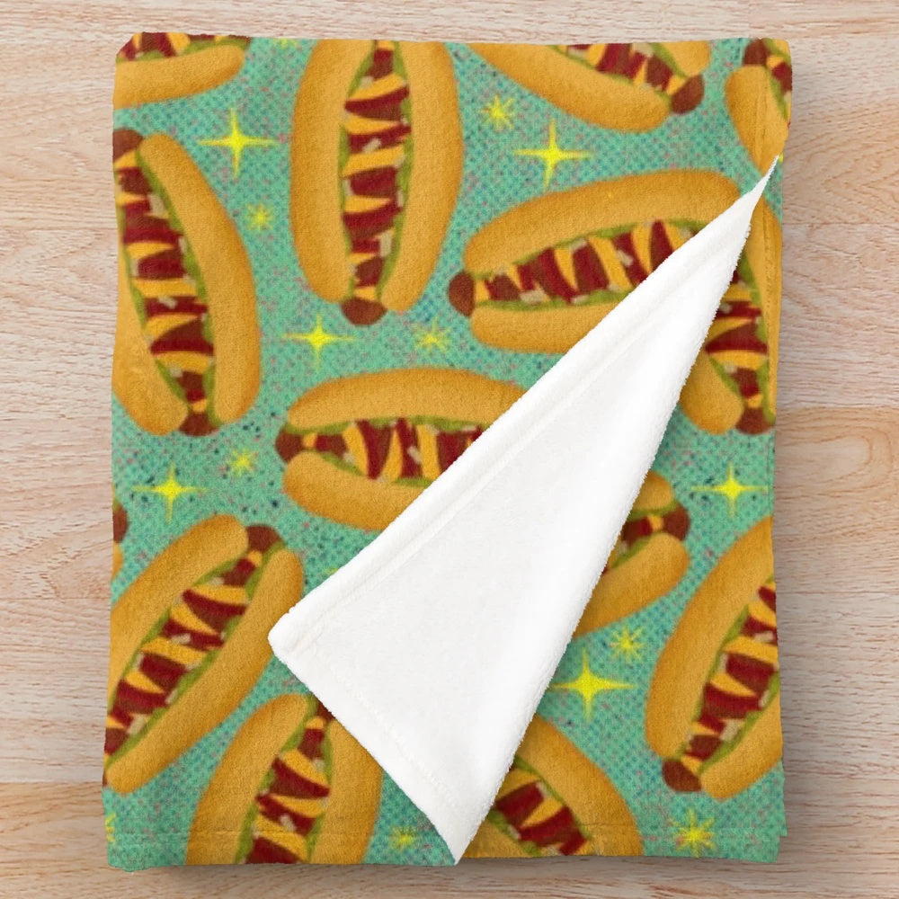 Plush blanket featuring a retro-style hot dog design, perfect for movie nights and nostalgic vibes.