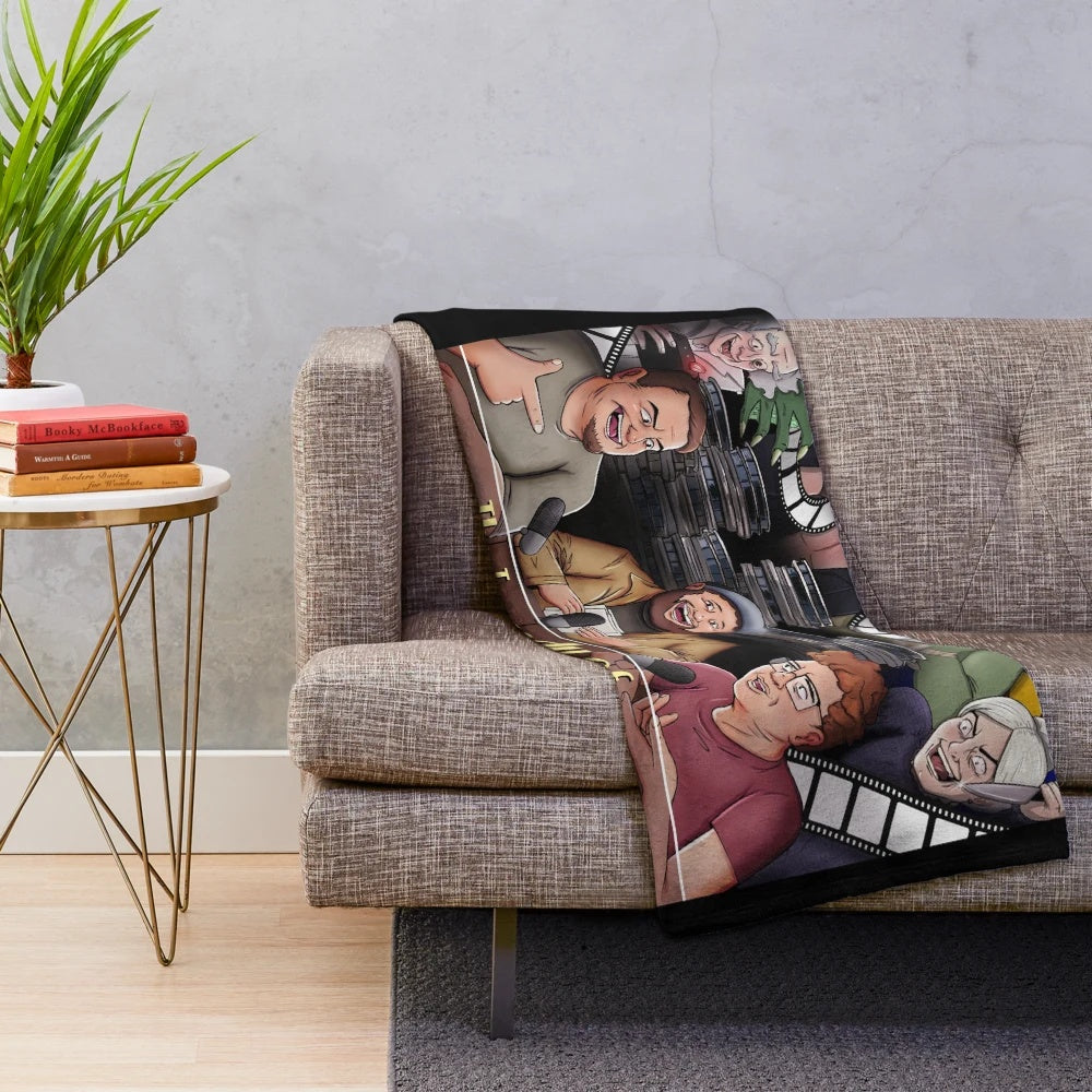 Plush blanket featuring a trio of cinema-themed characters