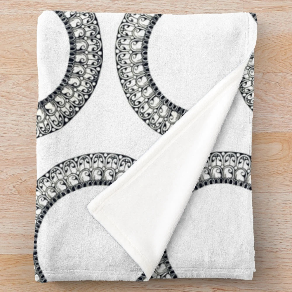 Plush circular blanket with artesian patterns