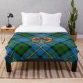 Clan MacLeod plush blanket featuring the clan's tartan and heraldic crest