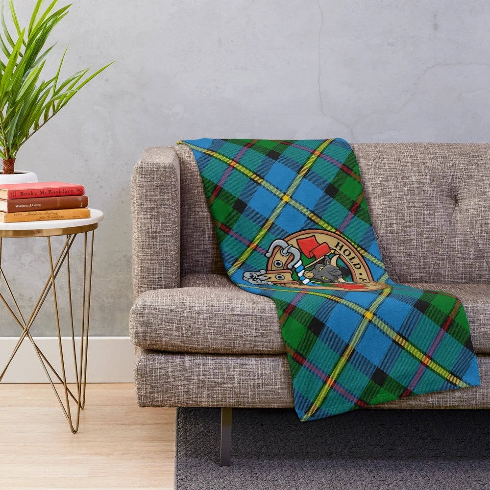 Clan MacLeod plush blanket featuring the clan's tartan and heraldic crest