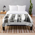 A soft and plush blanket featuring a clarinet design, perfect for music enthusiasts