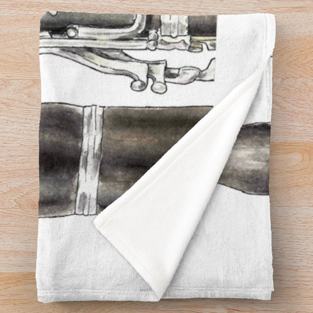 A soft and plush blanket featuring a clarinet design, perfect for music enthusiasts