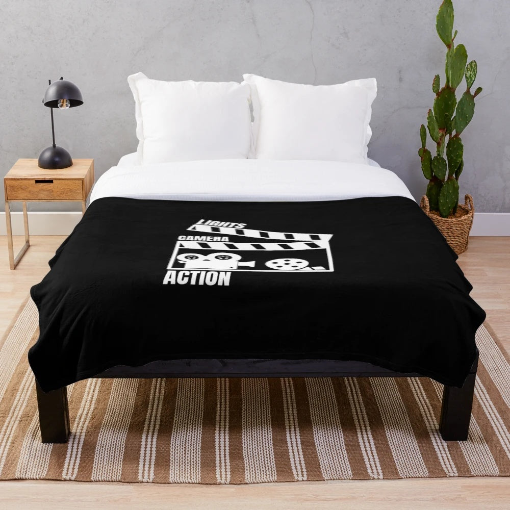 Vintage movie-themed plush blanket with "Cinema Action" text