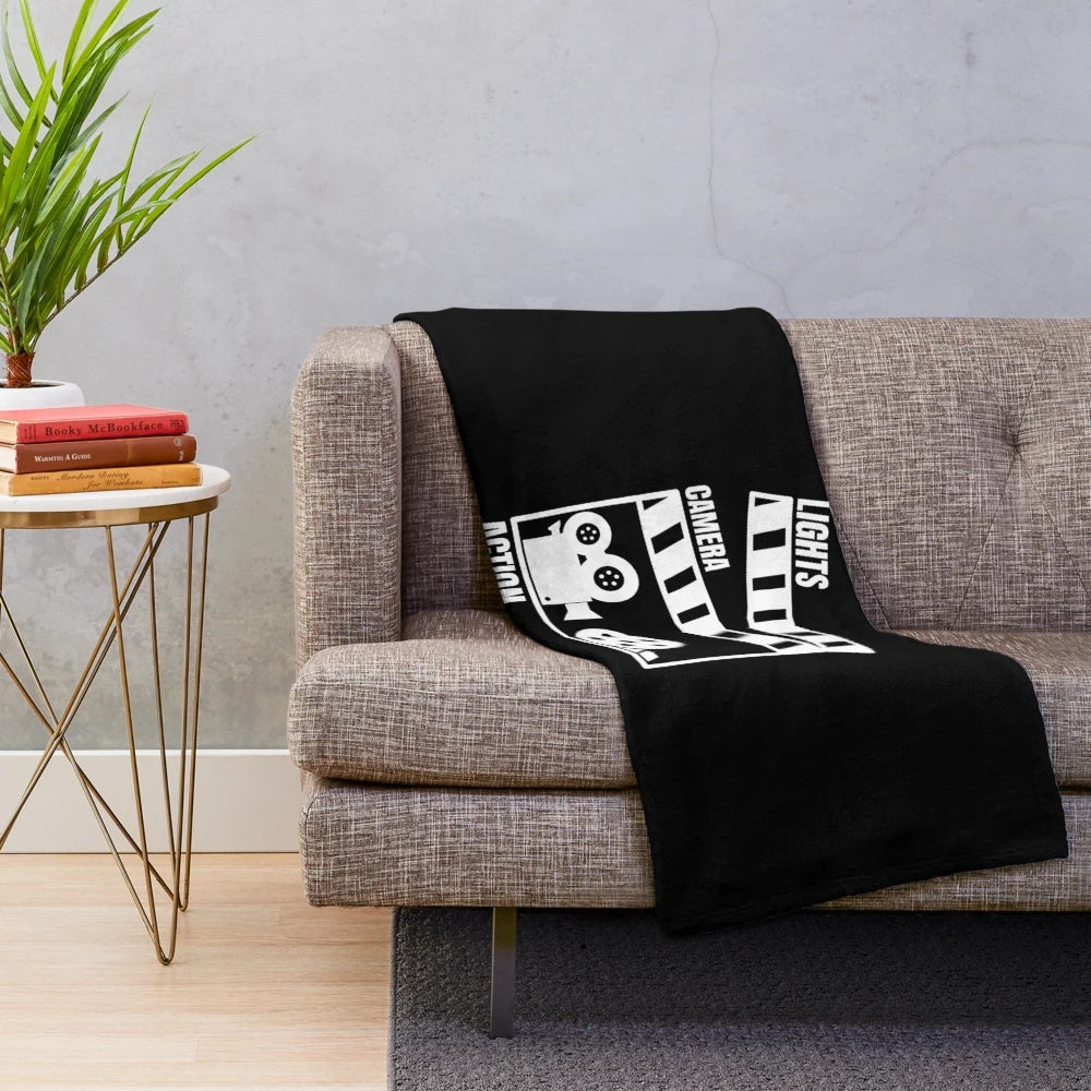 Vintage movie-themed plush blanket with "Cinema Action" text