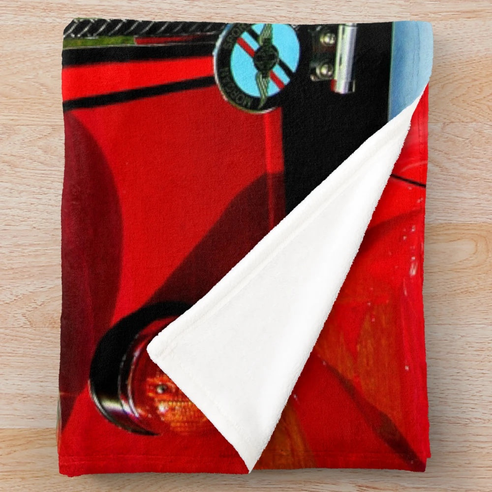 Cozy plush blanket featuring a classic Morgan sports car design