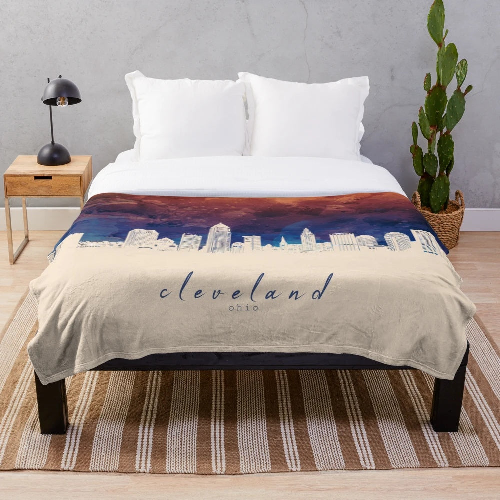 Plush blanket with a minimalist illustration of the Cleveland, Ohio city skyline