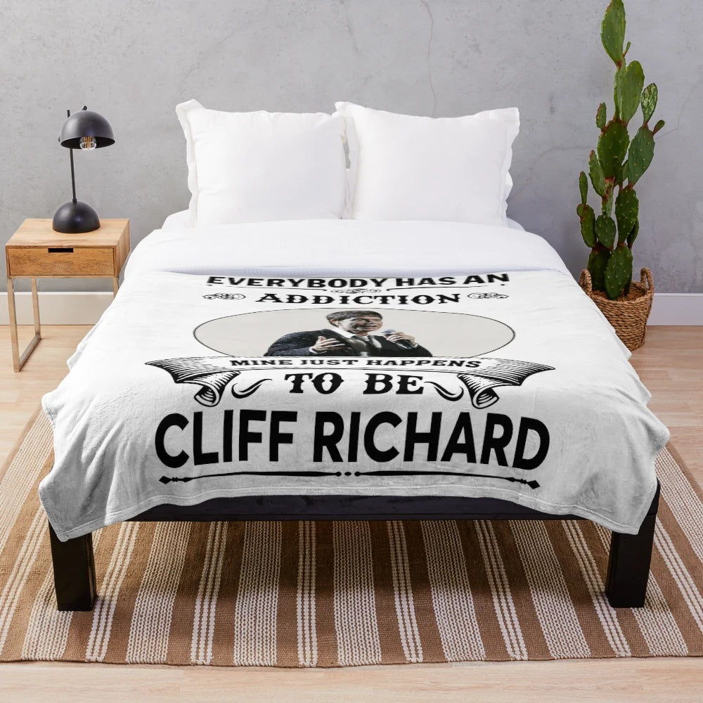 Soft and cuddly plush blanket featuring the iconic Cliff Richard from the classic TV show The Young Ones
