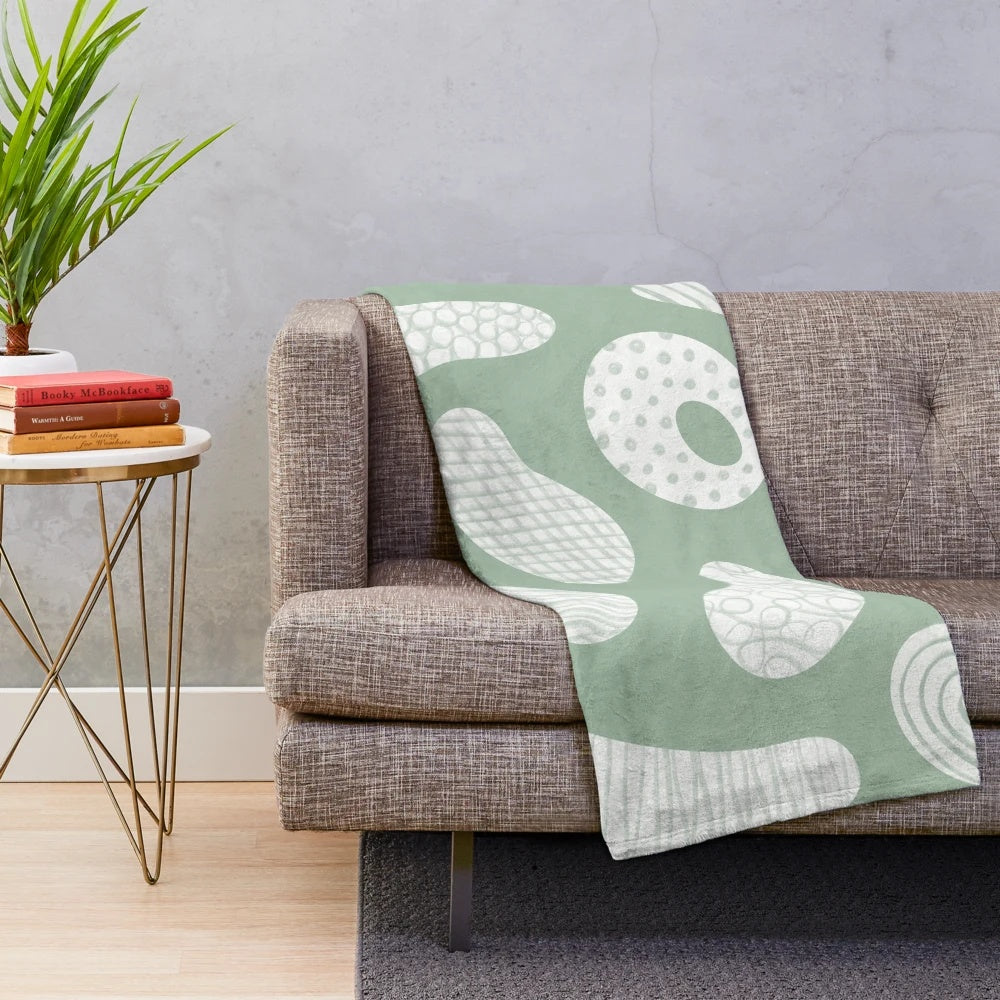 Soft plush blanket featuring colorful climbing holds design