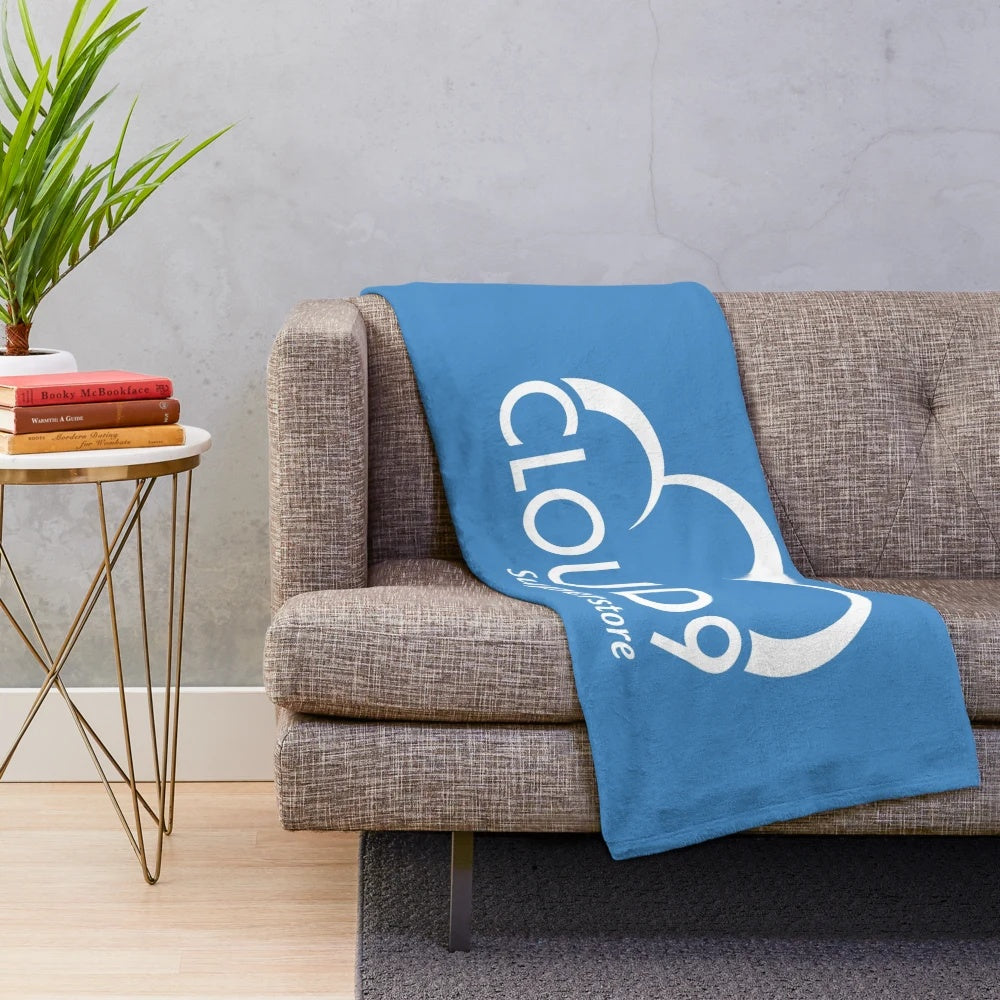 White plush blanket with Cloud 9 Superstore inspired design