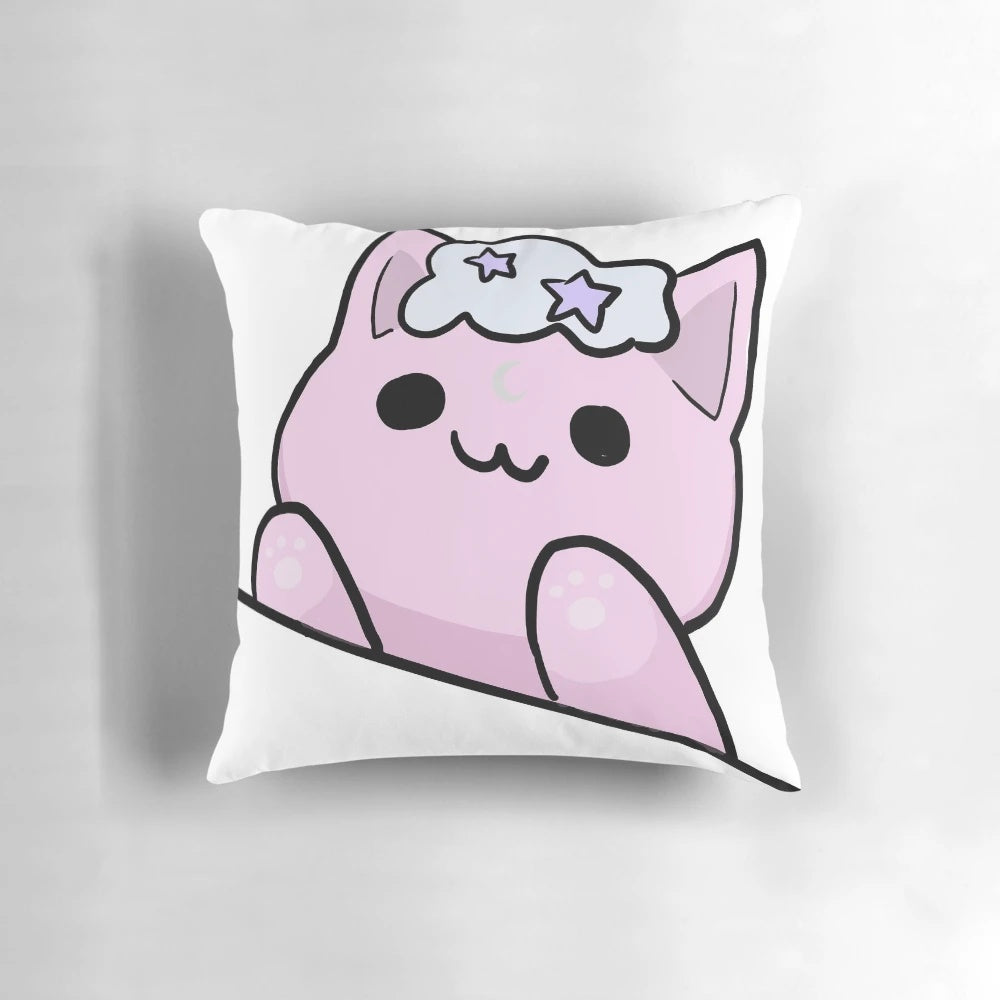 A fluffy white cloud-shaped pillow with a cute pink cat face and crescent moon design.
