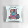 Soft, plush pillow featuring a whimsical design of a cat lounging on a couch with a cup of coffee and books.