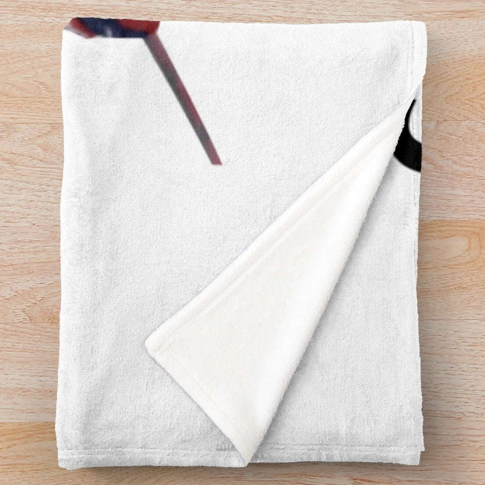 Image of a plush blanket featuring hockey player Cole Caufield