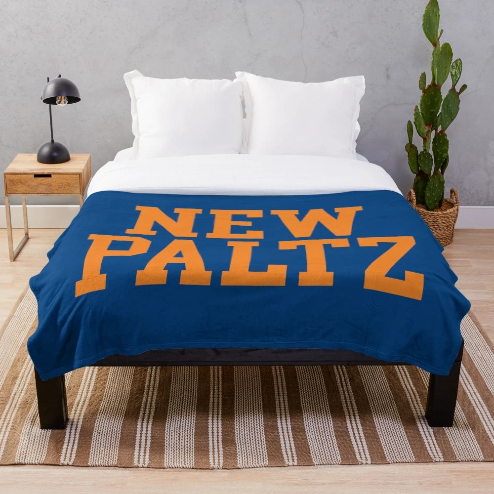 New Paltz college plush blanket with varsity-style curved text design