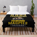 Collingwood-inspired plush blanket with AFL team colors and logo