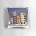 Vibrant pillow with a winter landscape of colorful houses and a starry night sky
