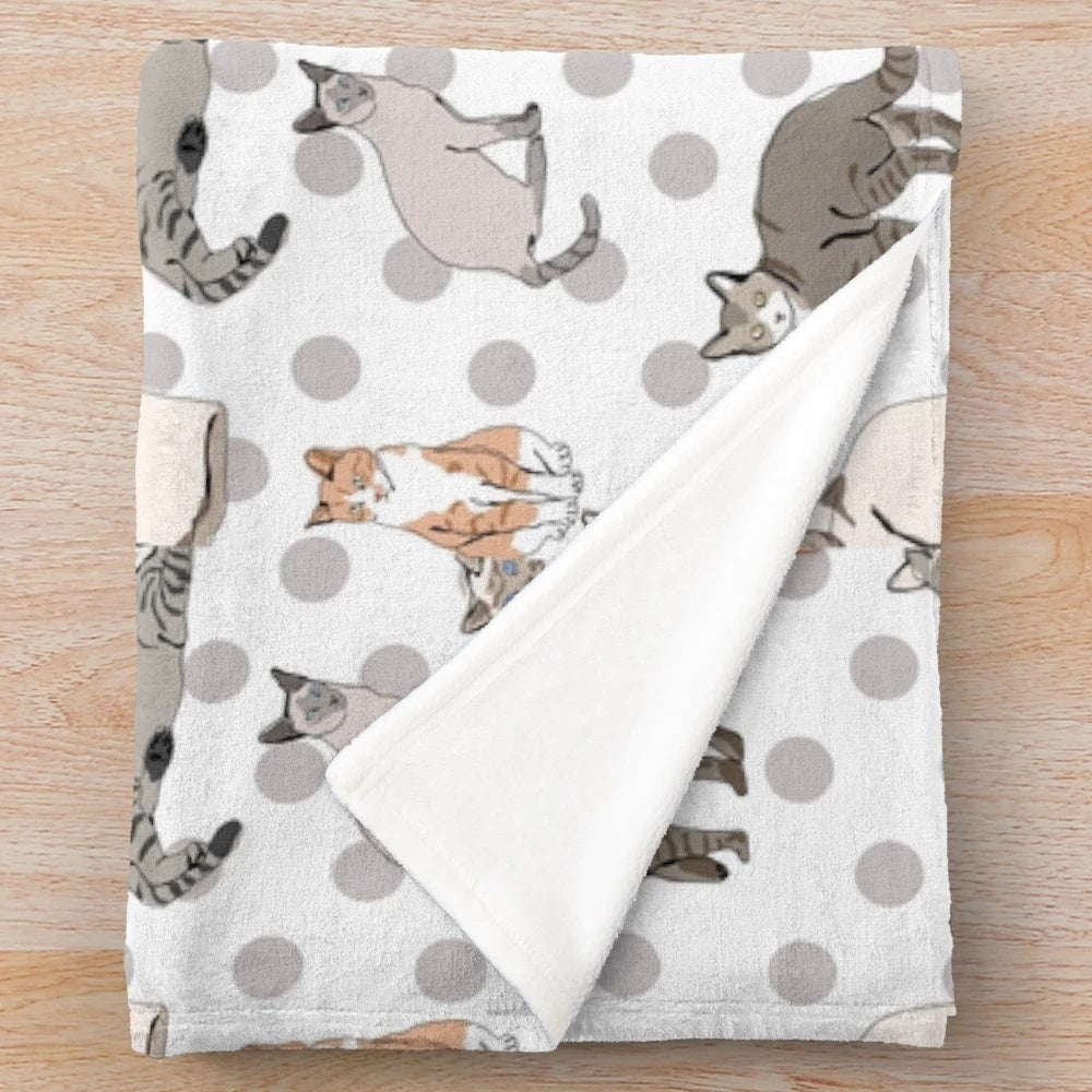 Plush blanket featuring a whimsical design of confused cats in polka dot patterns