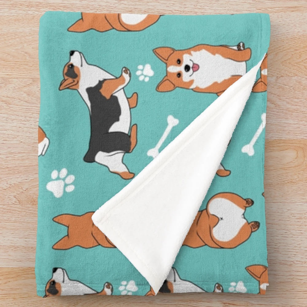 Corgi pattern plush blanket with blue background and dog paw and bone designs