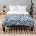Blue plush blanket featuring a cute corgi dog pattern