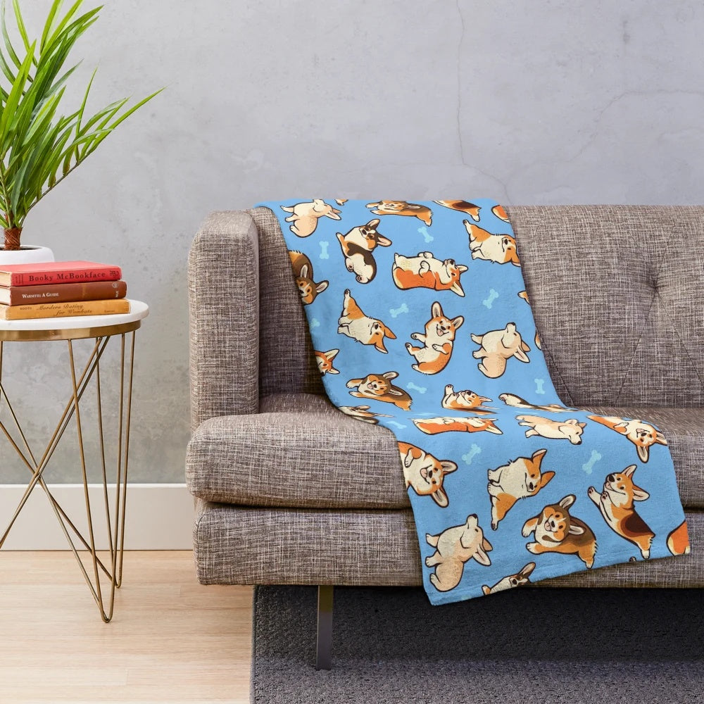 Blue plush blanket featuring a cute corgi dog pattern