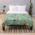 A plush blanket featuring a design of cute corgis in a green pattern