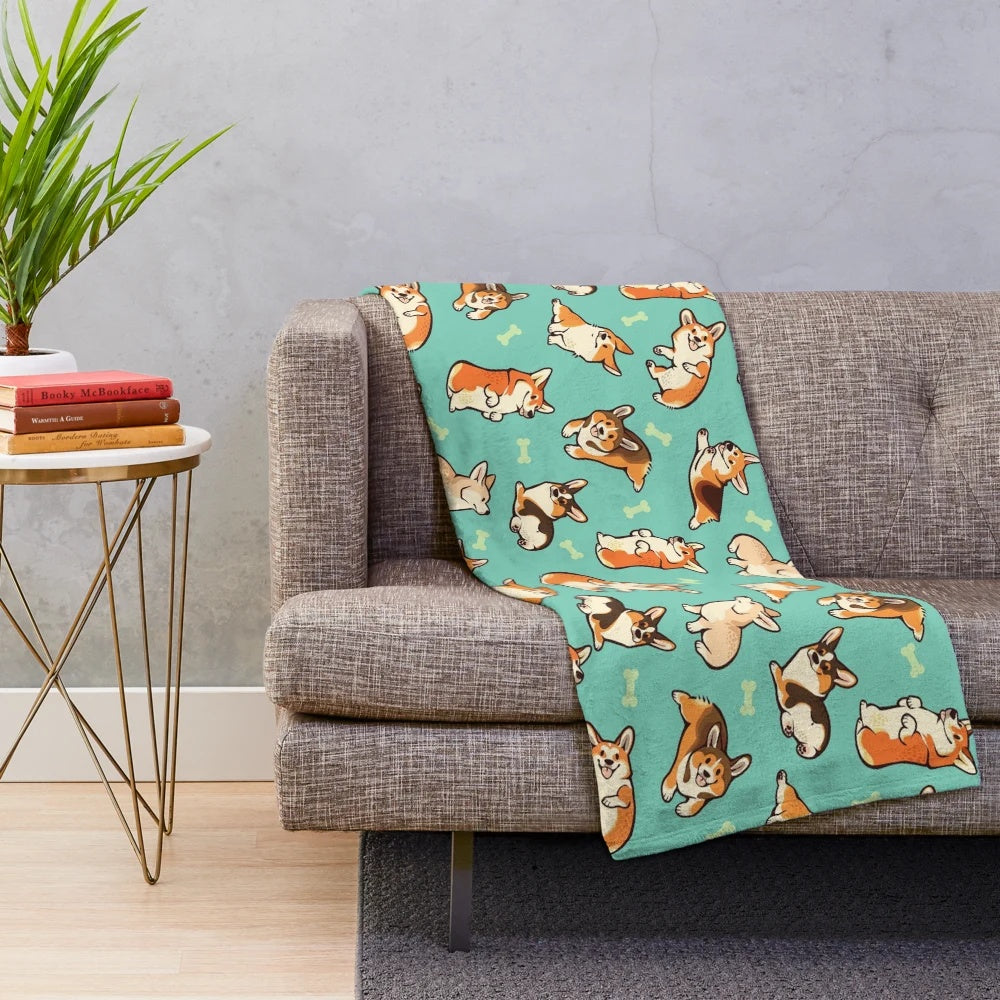 A plush blanket featuring a design of cute corgis in a green pattern