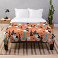 Orange plush blanket featuring corgis in a fall forest scene