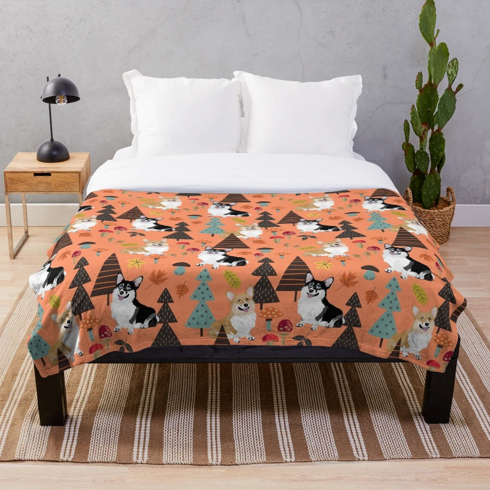 Orange plush blanket featuring corgis in a fall forest scene