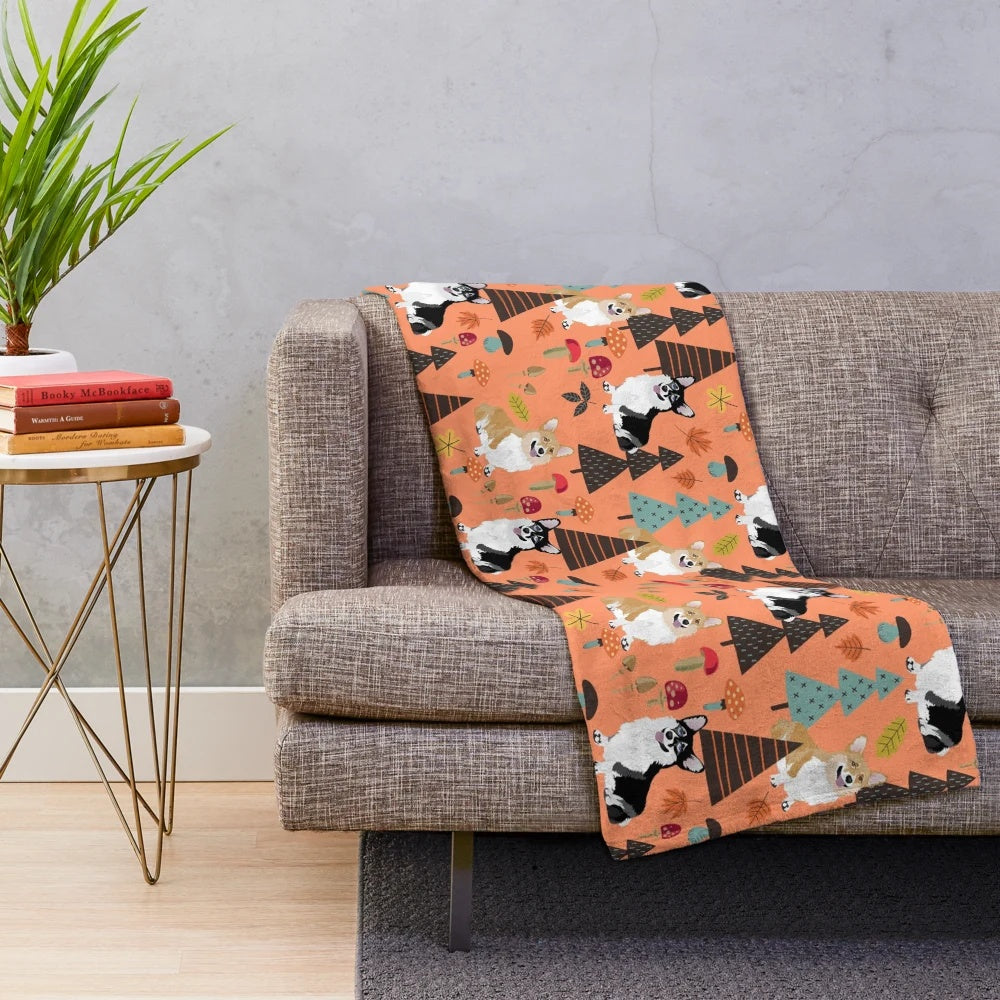 Orange plush blanket featuring corgis in a fall forest scene