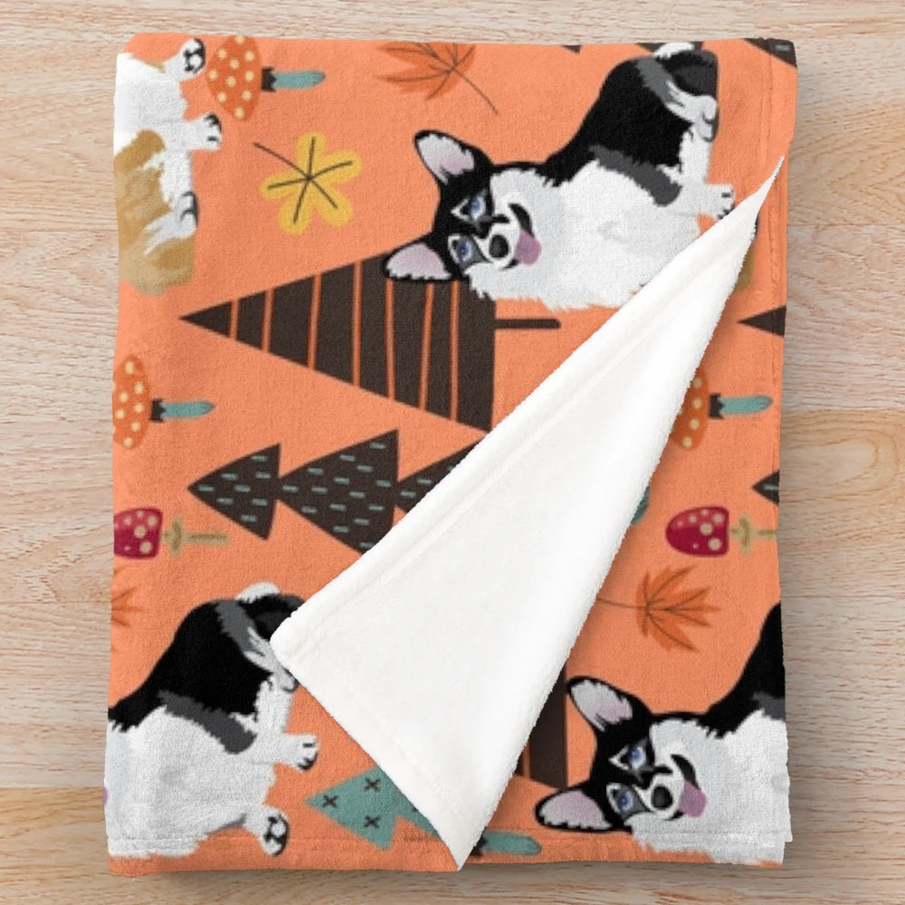 Orange plush blanket featuring corgis in a fall forest scene