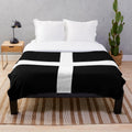 Soft and warm plush blanket featuring the St. Piran's flag of Cornwall