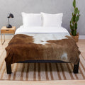 Soft, plush cow print blanket for rustic farmhouse or western-themed home decor
