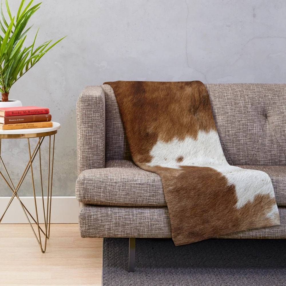 Soft, plush cow print blanket for rustic farmhouse or western-themed home decor