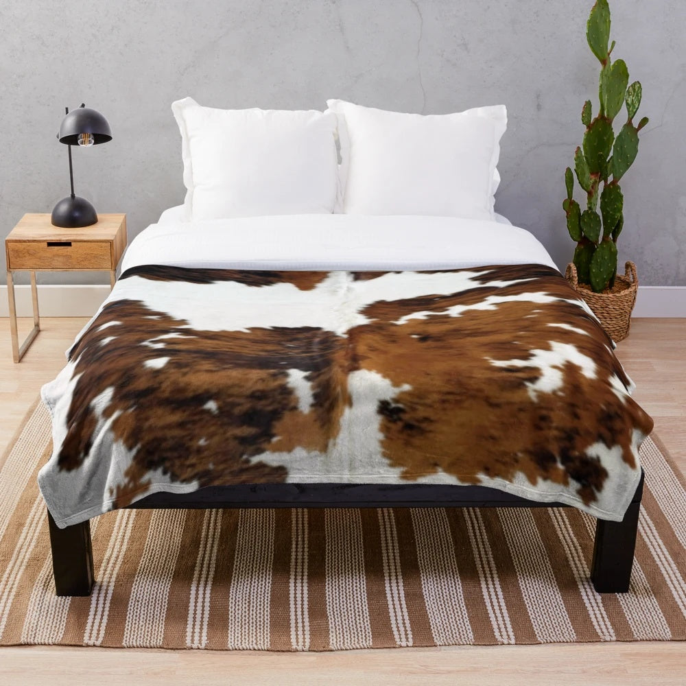 Soft and plush cow hide print blanket for cozy farmhouse decor