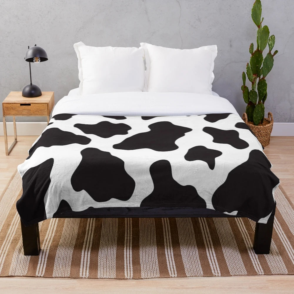 Soft, plush cow print blanket perfect for a country, ranch or farm-inspired home decor