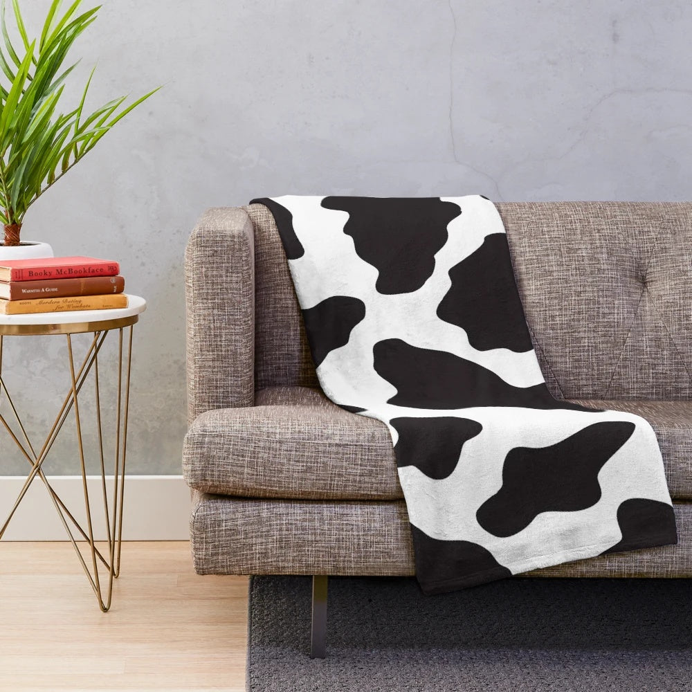 Soft, plush cow print blanket perfect for a country, ranch or farm-inspired home decor
