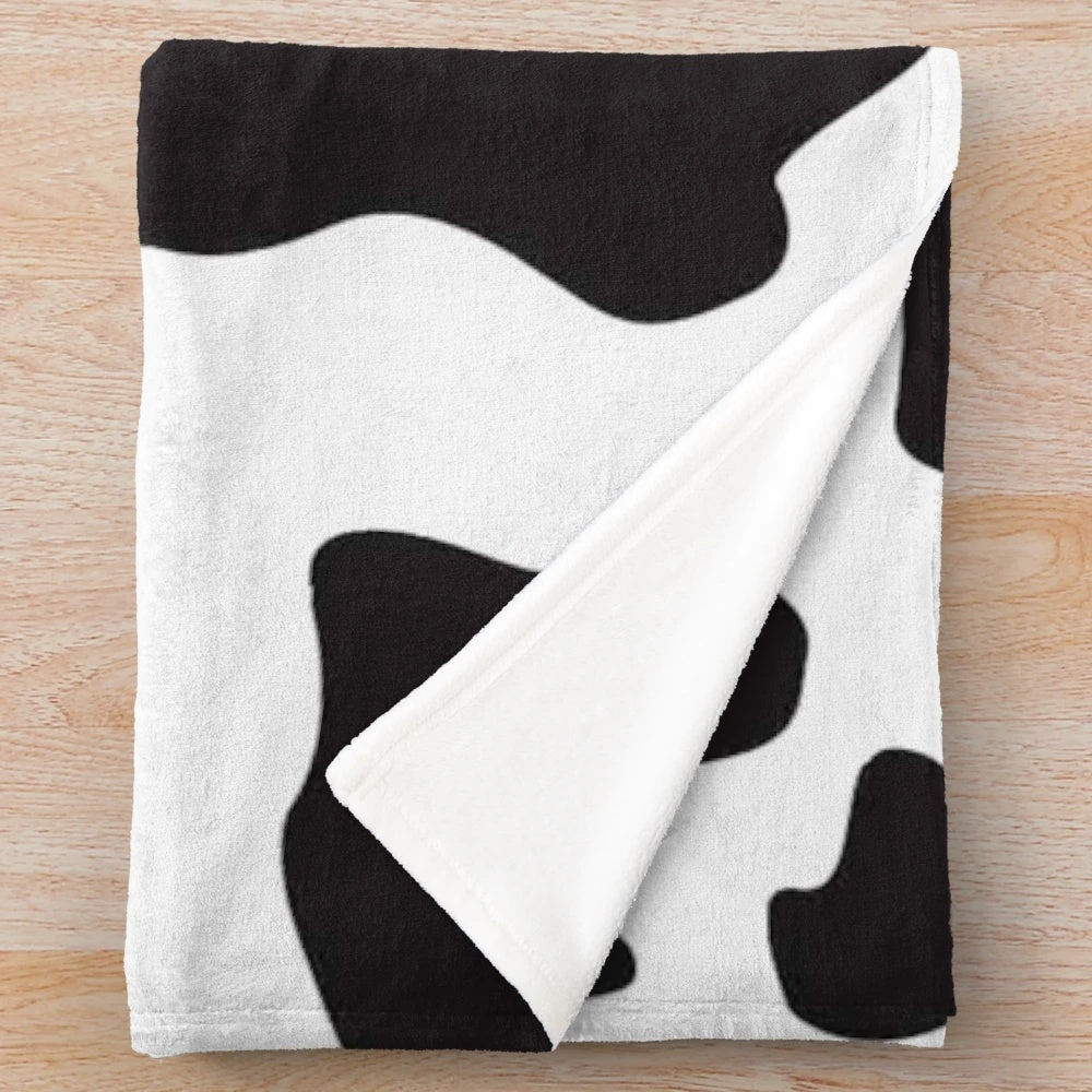 Soft, plush cow print blanket perfect for a country, ranch or farm-inspired home decor