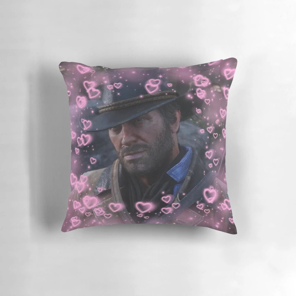 A plush, heart-shaped pillow featuring the character Arthur Morgan from the Red Dead Redemption video game series.