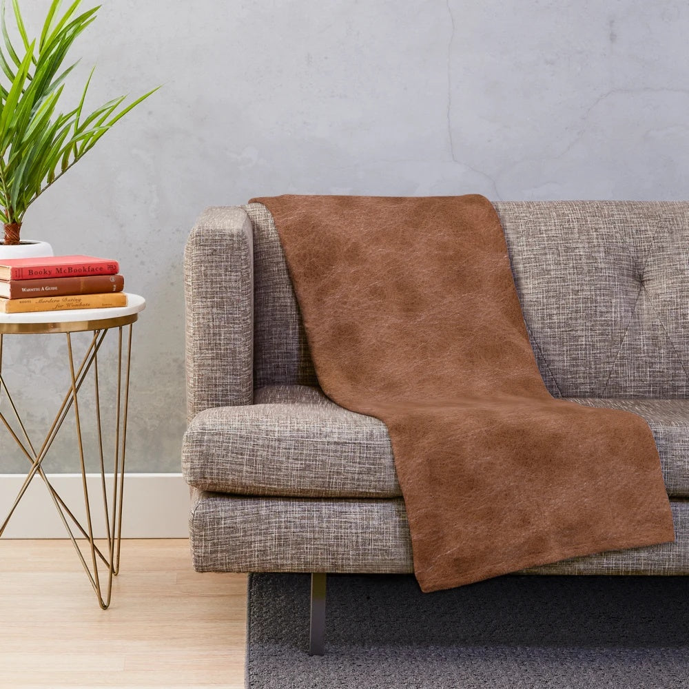 Cowhide-inspired plush blanket with a soft, warm, and comfortable texture