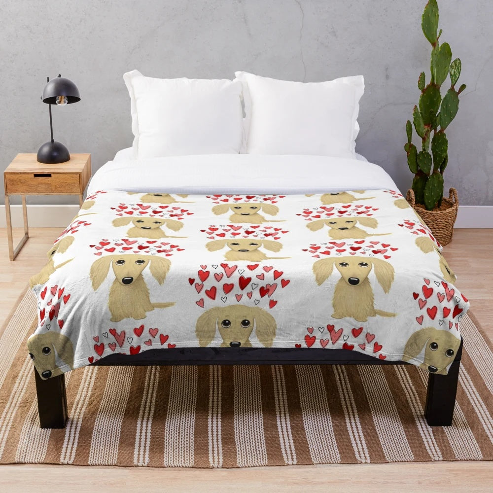 Soft and cuddly cream-colored long-haired dachshund plush blanket with heart pattern