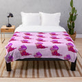 A sweet and spooky pastel goth plush blanket featuring creepy cute designs