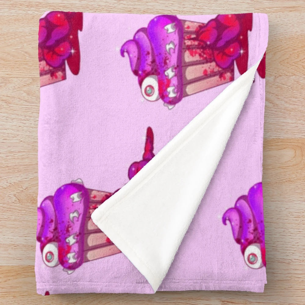A sweet and spooky pastel goth plush blanket featuring creepy cute designs