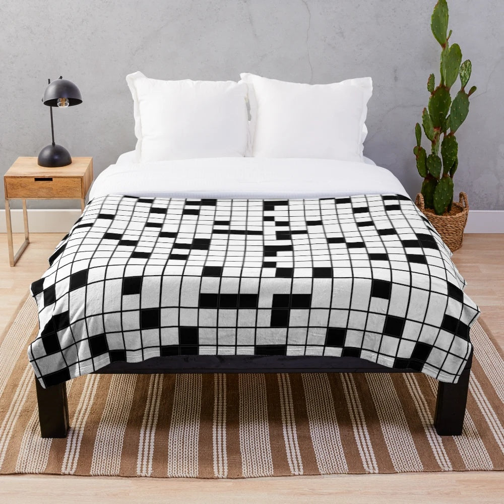 Crossword puzzle plush blanket in black and white grid pattern