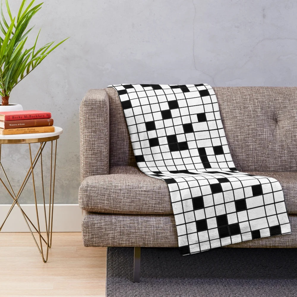 Crossword puzzle plush blanket in black and white grid pattern
