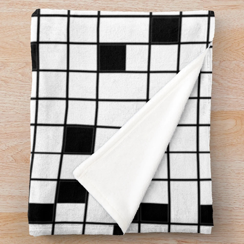 Crossword puzzle plush blanket in black and white grid pattern