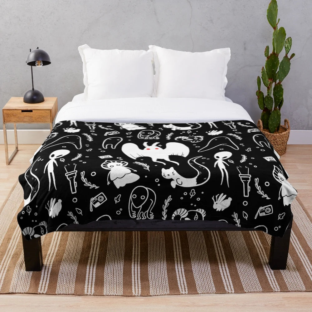 Soft and plush blanket featuring a cryptid design