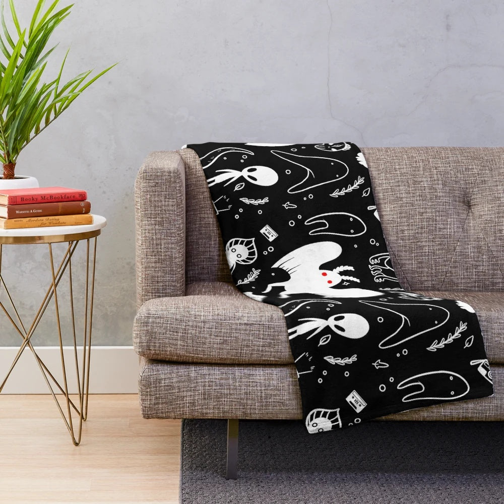 Soft and plush blanket featuring a cryptid design