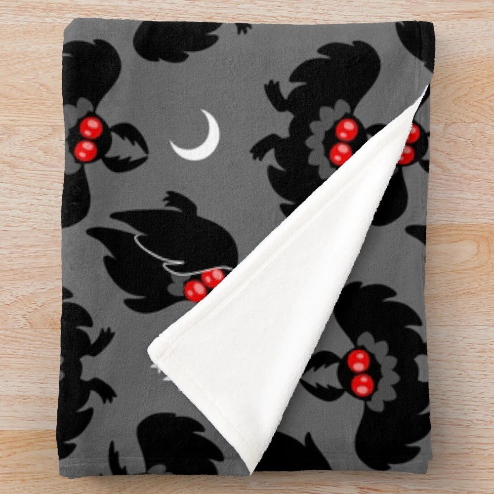 Mothman pattern plush blanket, featuring a cozy cryptid design