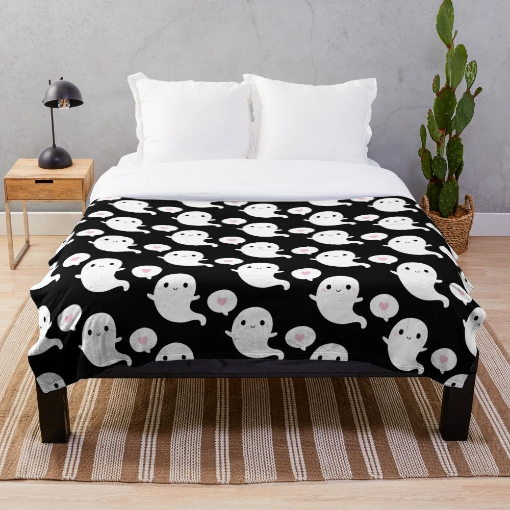 Soft and plush blanket featuring a cute, smiling ghost design in a cozy autumn theme