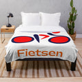 Cycling-themed plush blanket with a vintage, retro design